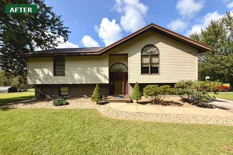 Ranch house with a freshly cut lawn, new river rock beds, and trimmed foundation shrubs